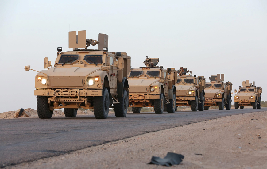 Military armoured vehicles carrying soldiers loyal to Yemen's exiled government are seen on a road in the northern province of Marib on Wednesday (Reuters photo)