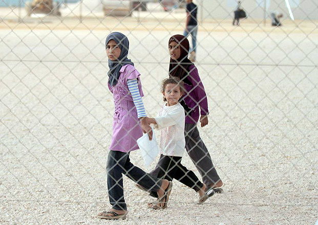 In this recent photo, girls are seen at the Zaatari Refugee Camp. There has been a rise in early marriages among Syrian refugees  (Photo by Nader Daoud)