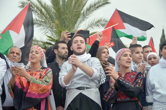 Al Hannouneh Society for Popular Culture members perform a traditional dance outside the US embassy in Amman in solidarity with Jerusalem on Friday (Photo by Muath Freij)