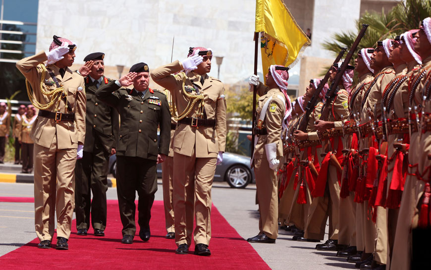His Majesty King Abdullah attends a ceremony held by the military to celebrate national days in Amman on Wednesday  (Photo courtesy of Royal Court)