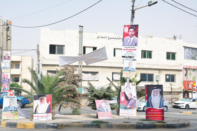 Election campaign posters are seen in an Amman square this week  (Photo by Amjad Ghsoun)