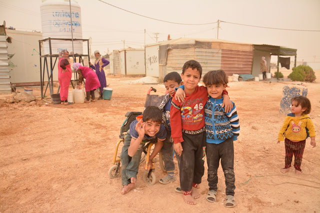In this recent photo, Syrian children pose for a photo at Zaatari refugee camp near Mafraq (Photo by Amjad Ghsoun)