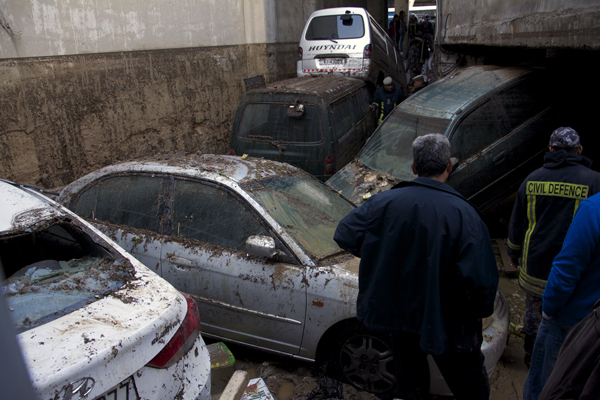 Damaged cars are seen in downtown Amman, November 5, 2015, in the morning after rising water from heavy rains. Flash floods caused by torrential rain killed 4 people (Photo by Amjad Ghsoun)