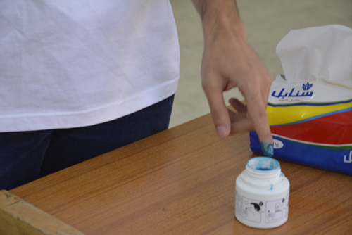 Voters are required to dip their left index fingers in indelible ink after casting their ballot (Photo by Amjad Ghsoun)