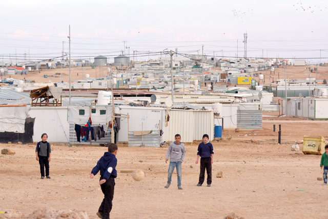 Children are seen playing football in the Zaatari refugee camp, some 80km northeast of Amman, in this photo taken on January 28, 2018 (Photo by Amjad Ghsoun)