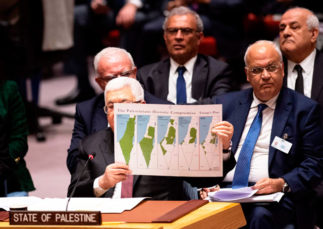 Palestinian President Mahmoud Abbas holds up a map of US President Donald Trump's Middle East plan as he speaks to the UN Security Council at the United Nations headquarters on Tuesday in New York (AFP photo)