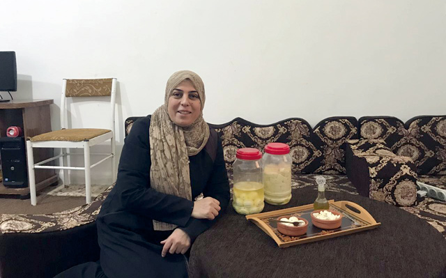 Syrian national Abeer Abbas was able to establish her own income-generating business, transforming a modestly equipped kitchen into a small workshop manufacturing dairy products (Photo courtesy of CARE Jordan)