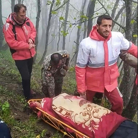 This grab taken from handout video footage released by the Iranian Red Cescent on May 20, 2024 shows rescuers recovering bodies at the site of President Ebrahim Raisi's helicopter crash in a fog-shrouded mountainous area of northwest Iran. Iranian President Ebrahim Raisi was declared dead on May 20, 2024, after rescue teams found his crashed helicopter in a fog-shrouded western mountain region, sparking mourning in the Islamic republic. (AFP Photo)