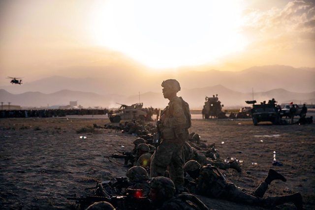 This US Marine Corps photo released on Wednesday shows US army soldiers assigned to the 10th Mountain Division standing guard at Hamid Karzai International Airport, Kabul, on Tuesday (AFP photo)