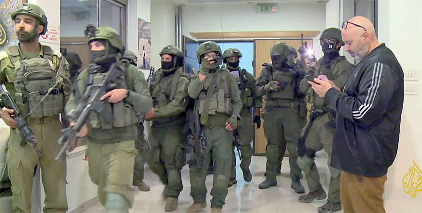 An image grab from footage distributed by the Doha-based Al Jazeera TV on Sunday shows Israeli soldiers entering Al Jazeera's office in Ramallah, in the West Bank (AFP photo)