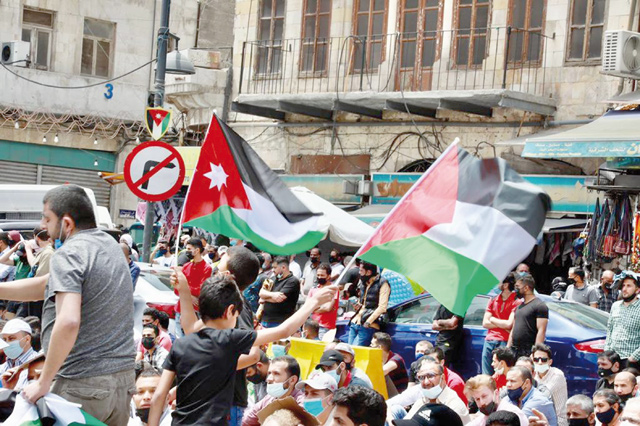 Jordanians organising a sit-in on Friday in Amman downtown to protest the Israeli occupation's violations in Jerusalem and to express solidarity with the Palestinian people (Photos by Osama Aqarbeh)
