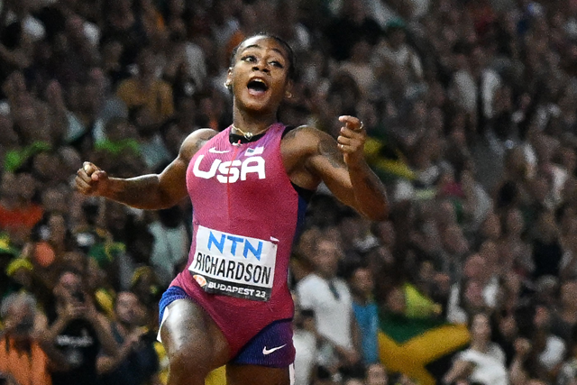 USA’s Sha’Carri Richardson reacts after winning the women’s 100m final during the World Athletics Championships at the National Athletics Centre in Budapest on Monday (AFP photo by Jewel Samad)