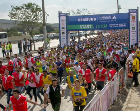  Runners take off from the start of the 2015 Samsung Amman Marathon 10km race in Amman (Photo by Amjad Ghsoun)