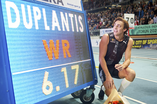 Sweden’s Armand Duplantis celebrates next to the board after setting a world pole vault record at the Orlen Copernicus Cup 2020 World Athletics Indoor meeting in Torun, Poland, on Saturday  (AFP photo by Lukasz Szelag)