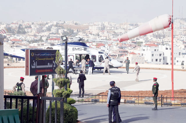An emergency response team is seen transferring Jerash knife attack victims from a helicopter to the King Hussein Medical Centre in Amman on Wednesday (Al Rai photo)