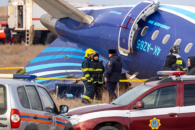 Emergency specialists work at the crash site of an Azerbaijan Airlines passenger jet near the western Kazakh city of Aktau on December 25, 2024 (AFP photo)