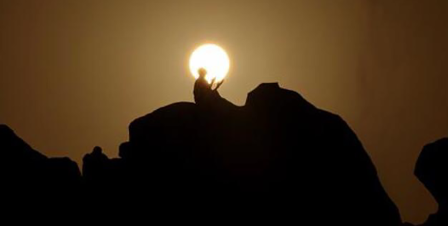 Muslim pilgrims pray at dawn on Saudi Arabia's Mount Arafat, also known as Jabal al-Rahma or Mount of Mercy, during the climax of the Hajj pilgrimage on June 15, 2024 (AFP Photo)