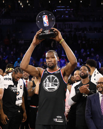 Kevin Durant of the Golden State Warriors and Team LeBron celebrates with the MVP trophy after their NBA All-Star game win over Team Giannis in Charlotte, North Carolina, on Sunday (AFP photo by Streeter Lecka)
