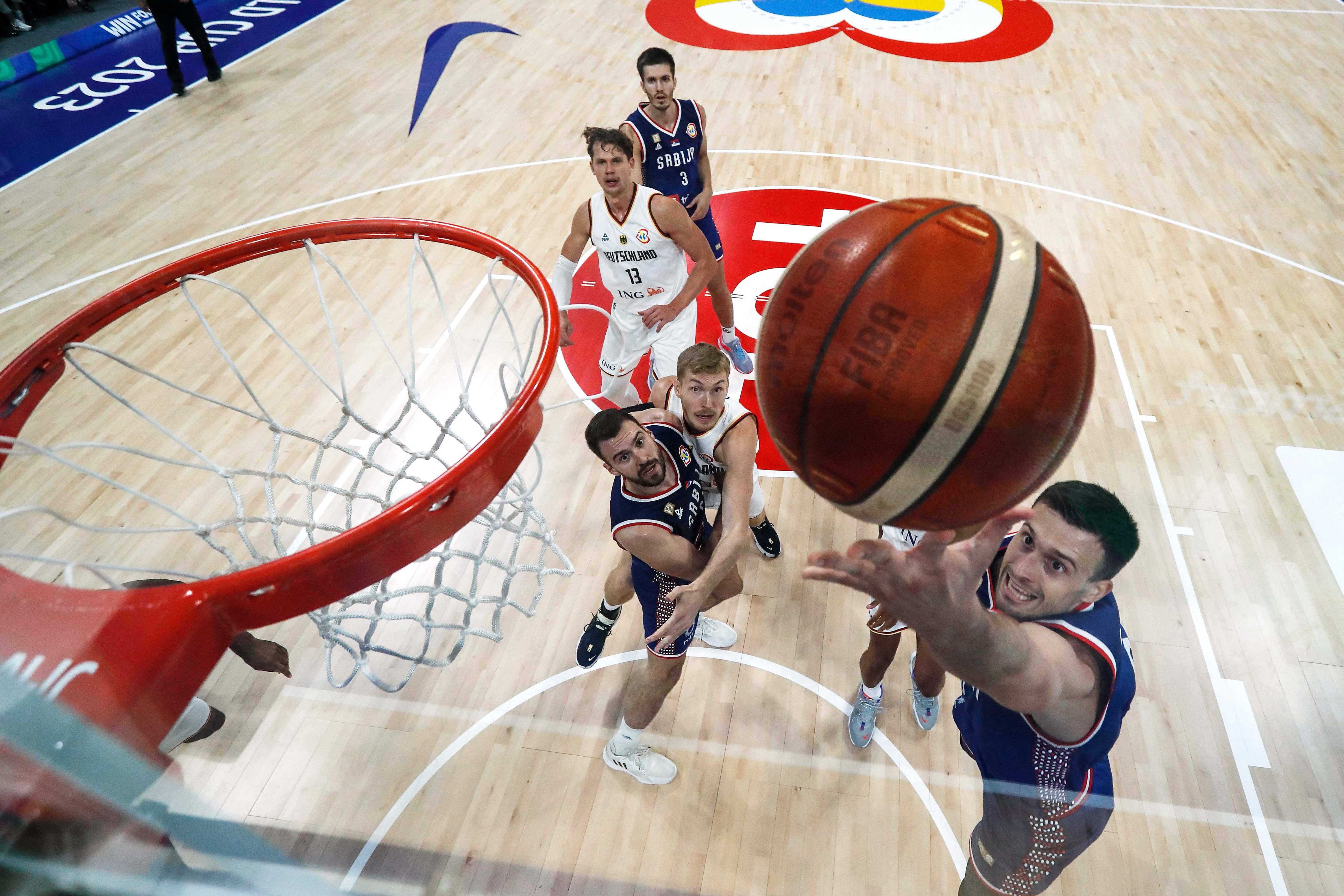 Serbia's Aleksa Avramovic (right) drives to the basket during the FIBA  World Cup final game against Germany in Manila on Sunday (AFP photo) 