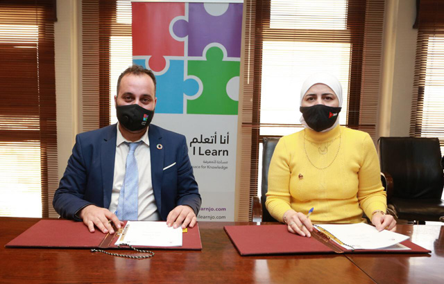 Digital Economy and Entrepreneurship Ministry Acting Secretary General Samira Zu’bi and Executive Director at ILearnJO Saddam Sayyaleh pose for a photo during a signing ceremony (Photo courtesy of The Ministry of Digital Economy and Entrepreneurship)