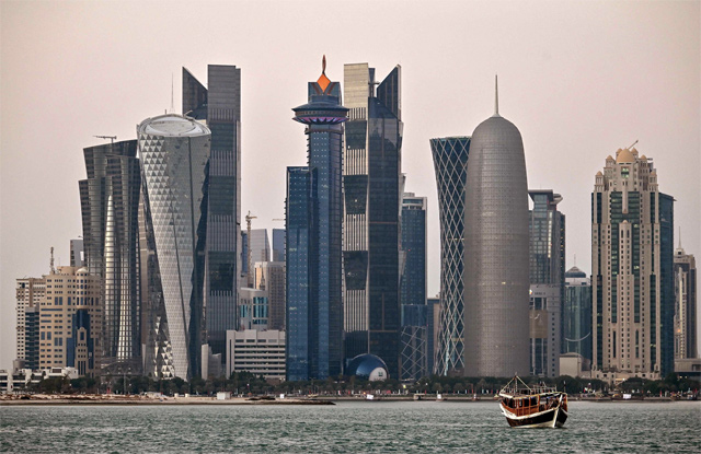 This photo taken on December 20, 2019, shows a view of boats moored in front of high-rise buildings in the Qatari capital, Doha (AFP file photo)