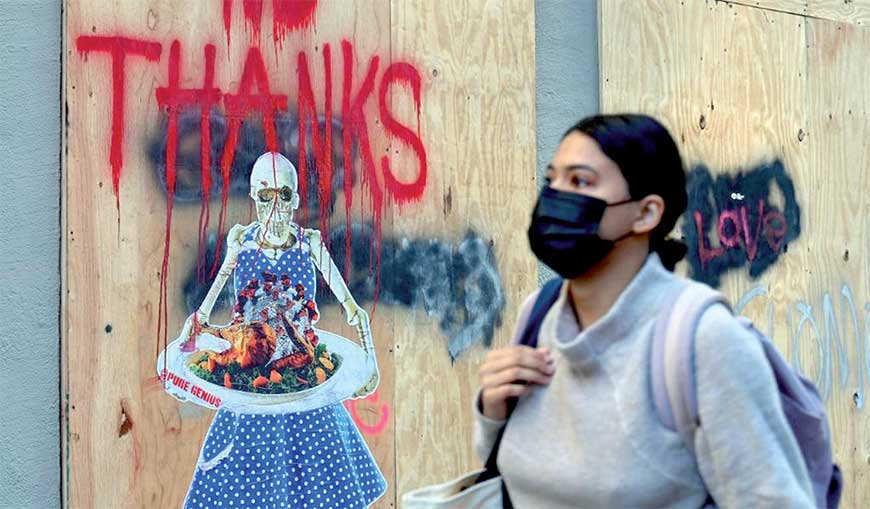As the US prepares for Thanksgiving, several cities around the world including New York have been forced to impose containment measures (AFP photo)