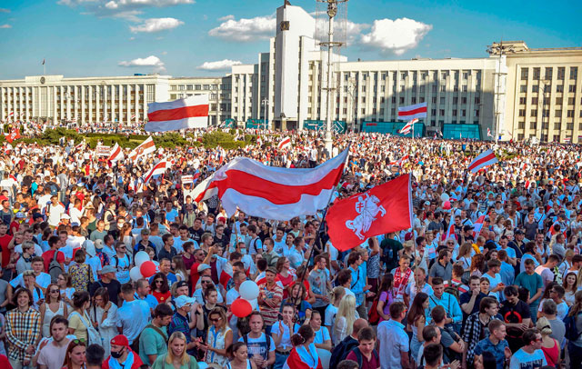 Belarus opposition supporters attend a rally in central Minsk on Sunday (AFP photo)