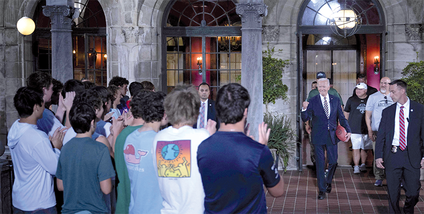 US President Joe Biden meets with members of Archmere Academy's football team while visiting the school where tomorrow's Quadrilateral summit will be held on Friday, in Claymont, Delaware (AFP photo)