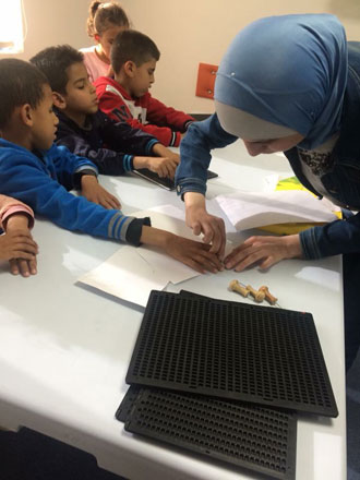 Sara Abu Ali teaches Braille literacy to children with visual impairment in Jordan (Photos courtesy of Lughatna Gheir initiative)