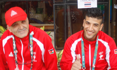Jordan’s boxer Obada Al Kesbeh sits alongside his coach, Azeddine Aggoune, at the Olympic Village in Rio de Janeiro on Wednesday (Photo courtesy of the JOC News Service)