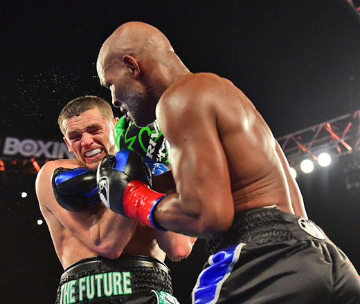 Joe Smith Jr. takes a punch from Bernard Hopkins as Smith goes on to win the WBC International Light Heavyweight title on Saturday in Inglewood, California (AFP photo by Harry How)