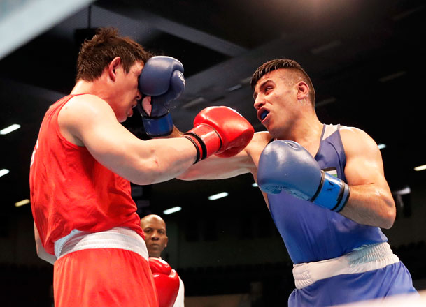 Jordan’s Hussein Ishaish (right) fights Hyeongkyu-kim of South Korea in the quarter-finals of the Asian/Oceanian Road to Tokyo 2020 Boxing qualifying event in Amman on Friday (Photo courtesy of the Jordan Olympic Committee News Service)