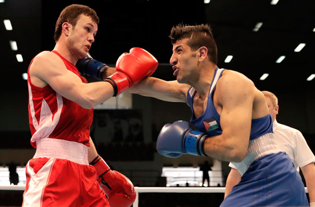 Jordan’s Obada Al Kesbeh take on Tajikistan’s Bakhodur Usmonov (right) in the Lightweight 63kg category at the Asian/Oceanian Road to Tokyo 2020 Boxing qualifying event in Amman on Monday (Photo courtesy of the Jordan Olympic Committee News Service)