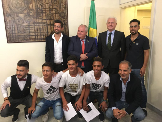 Brazilian Ambassador to Jordan Francisco Carlos Soares Luz pose for a group photo with young Syrian refugees at the embassy on Sunday (Photo by Camille Dupire)