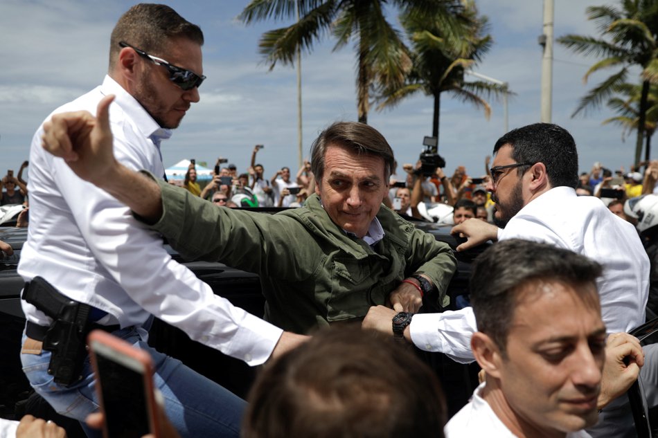  Jair Bolsonaro, far-right lawmaker and presidential candidate of the Social Liberal Party (PSL), gestures as he leaves after casting his vote, in Rio de Janeiro, Brazil (Reuters photo)