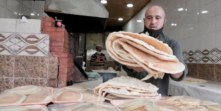 A baker is seen in Amman's Northern Hashmi neighbourhood in this recent photo (Photo by Osama Aqraba)