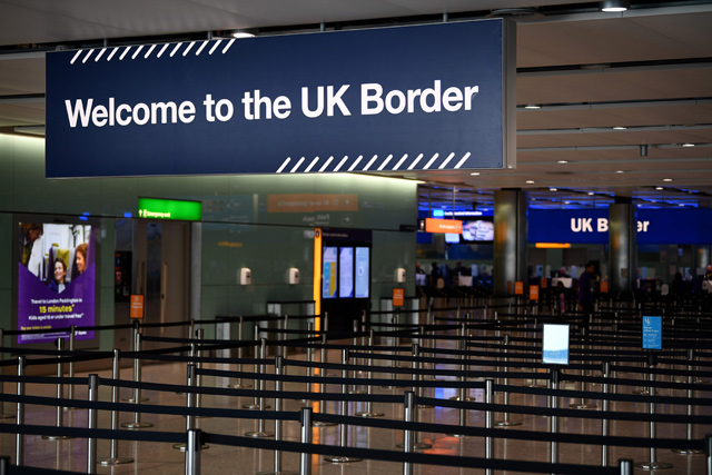 In this file photo taken on July 16, 2019 UK border signs are photographed at the passport control in Arrivals in Terminal 2 at Heathrow Airport in London (AFP photo)