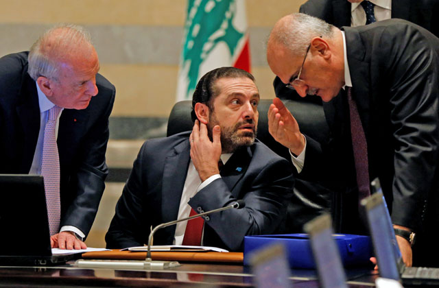 Finance Minister Ali Hassan Khalil gestures as he talks with Lebanon’s Prime Minister Saad Al Hariri during a Cabinet meeting at the governmental palace in Beirut, Lebanon, on Monday (Reuters photo)