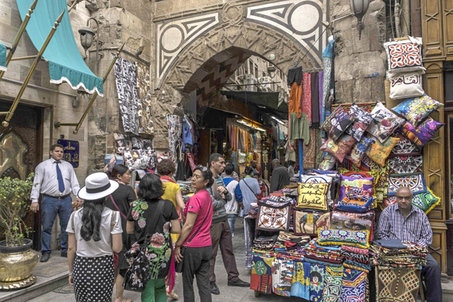 Tourists walk in the historical area of Al Hussein in the Egyptian capital Cairo on Wednesday (AFP photo)