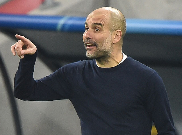 Manchester City's Spanish manager Pep Guardiola reacts against Borussia Moenchengladbach during their UEFA Champions League, last 16, 1st-leg match in Budapest on Wednesday (AFP photo by Attila Kisbenedek)