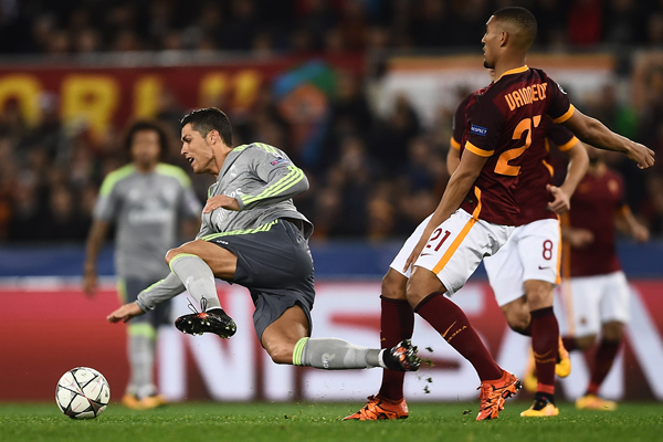 Real Madrid’s Portuguese forward Cristiano Ronaldo (left) fights for the ball with Roma’s forward William Vainqueur during their UEFA Champions League football match in Rome, on Wednesday (AFP photo by Filippo Monteforte)