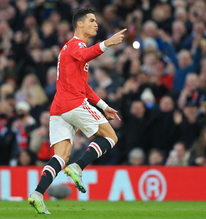  Manchester United’s Portuguese striker Cristiano Ronaldo celebrates after scoring the opening goal against Tottenham Hotspur during their English Premier League match in Manchester on Saturday (AFP photo by Lindsey Parnaby)