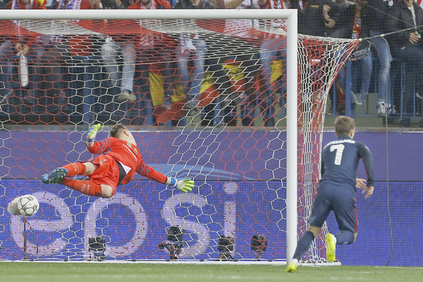 Atletico’s Antoine Griezmann (right) starts to celebrate after passing Barcelona’s goalkeeper Marc-Andre ter Stegen (left) and scoring his side’s first goal during their Champions League 2nd leg quarter-final match in Madrid, on Wednesday (AP photo by Francisco Seco)