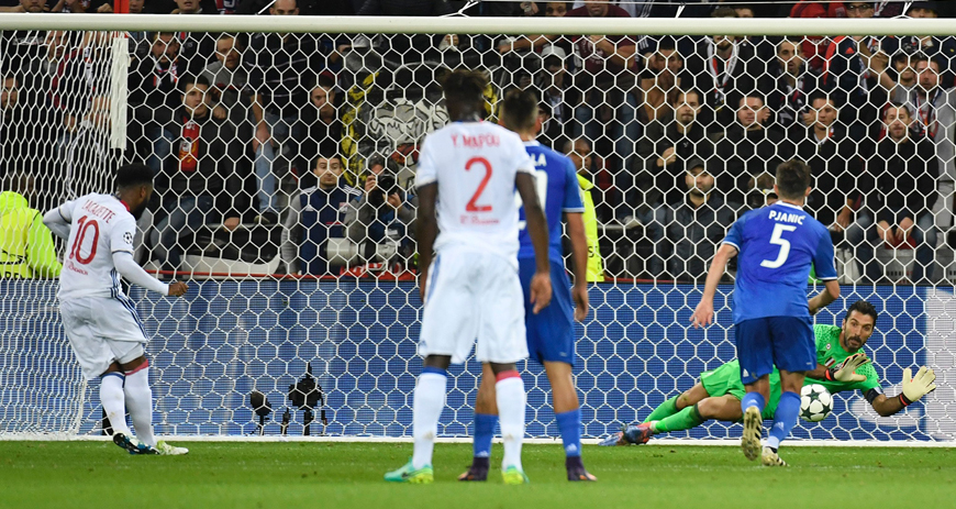 Lyon’s French forward Alexandre Lacazette (left) shoots a penalty stopped by Juventus’ Italian goalkeeper Gianluigi Buffon (right) during their Champions League match on Tuesday in Decines-Charpieu, France (AFP photo by Philippe Desmazes)