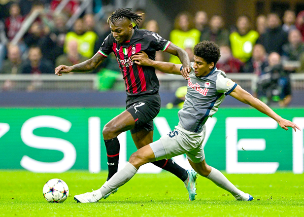 Salzburg’s Brazilian defender Bernardo (right) challenges AC Milan’s Portuguese forward Rafael Leao during their UEFA Champions League Group E match in Milan on Wednesday (AFP photo by Miguel Medina)