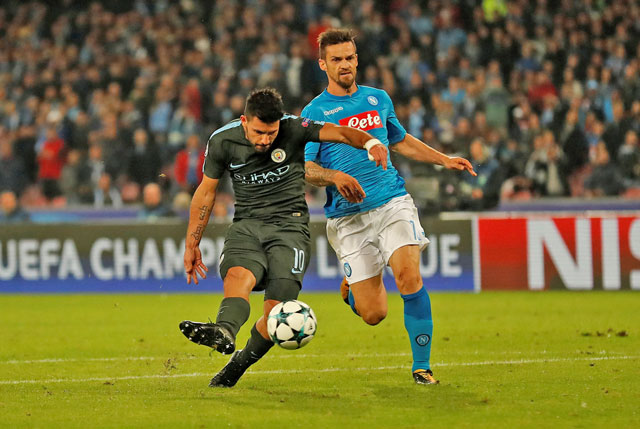 Manchester City’s Sergio Aguero shoots to score their third goal against Napoli in the Champions League match in Naples, Italy, on Wednesday (Reuters photo by Andrew Boyers)