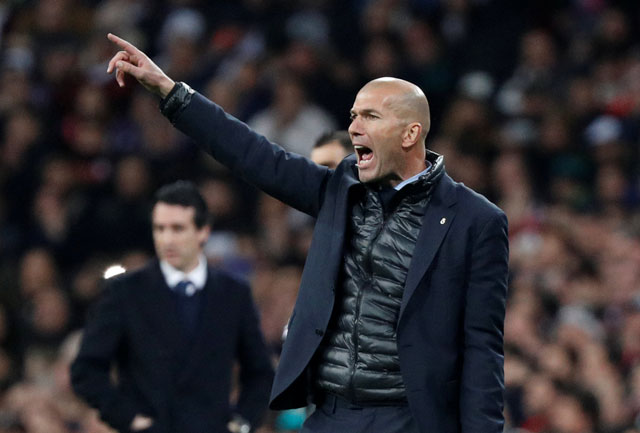 Real Madrid coach Zinedine Zidane yells instructions against Paris St Germain in their Champions League Round of 16 First Leg match in Madrid on Wednesday (Reuters photo by Paul Hanna)