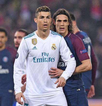 Real Madrid’s Portuguese forward Cristiano Ronaldo and Paris Saint-Germain’s Uruguayan forward Edinson Cavani (right) react during their UEFA Champions League round of 16 second leg football match in Paris on Tuesday (AFP photo by Franck Fife)