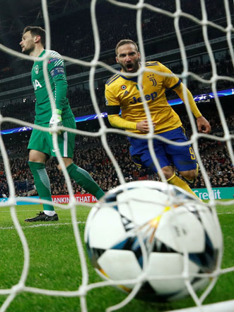 Juventus’ Gonzalo Higuain runs to retrieve the ball after he scores against Tottenham Hotspur during their Champions League Round of 16 second Leg match in London on Wednesday (Reuters photo by Eddie Keogh)
