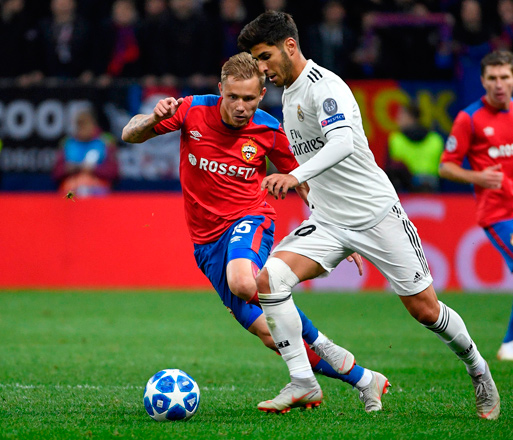 CSKA Moscow’s Russian forward Dmitri Efremov (left) and Real Madrid’s Spanish midfielder Marco Asensio vie for the ball during their UEFA Champions League group G football match in Moscow on Tuesday  (AFP photo by Alexander Nemenov)